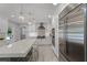 Modern kitchen with stainless steel appliances, a large island, and pendant lighting at 105 Laurel Oak Dr, Longwood, FL 32779