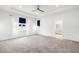 Spacious bedroom with a tray ceiling, plush carpeting, and natural light at 12216 Encore At Ovation Way, Winter Garden, FL 34787