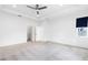 Bright bedroom with plush carpeting, tray ceiling, and a ceiling fan at 12216 Encore At Ovation Way, Winter Garden, FL 34787