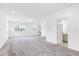 Bright bonus room with plush carpeting features recessed lights, two windows, and a bathroom entrance at 12216 Encore At Ovation Way, Winter Garden, FL 34787