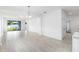 Bright living room with tile floors, recessed lighting, and a sliding glass door leading to the backyard at 12216 Encore At Ovation Way, Winter Garden, FL 34787