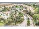 Scenic aerial view of the gated community with tree-lined streets, landscaping, and a grand entrance at 13584 Turtle Marsh Loop # 12, Orlando, FL 32837