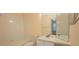 Clean bathroom featuring a vanity sink, toilet, and bathtub with white tile surround at 13584 Turtle Marsh Loop # 12, Orlando, FL 32837