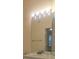 Bright bathroom with a large vanity mirror and recessed lighting at 13584 Turtle Marsh Loop # 12, Orlando, FL 32837