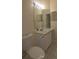Well-lit bathroom with a vanity, toilet, and tiled flooring at 13584 Turtle Marsh Loop # 12, Orlando, FL 32837