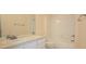 Bathroom with a tub and shower combo, toilet, and vanity at 13584 Turtle Marsh Loop # 12, Orlando, FL 32837