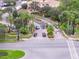Aerial view of a gated community entrance with landscaped medians and a roundabout at 13584 Turtle Marsh Loop # 12, Orlando, FL 32837