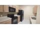 Well-equipped kitchen featuring stainless appliances, light countertops, and mosaic backsplash at 13584 Turtle Marsh Loop # 12, Orlando, FL 32837