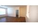 Spacious living room featuring wood floors, neutral paint, and lots of natural light at 13584 Turtle Marsh Loop # 12, Orlando, FL 32837