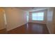 Bright living room features hardwood floors, neutral paint, and lots of natural light at 13584 Turtle Marsh Loop # 12, Orlando, FL 32837