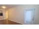 Living room with hardwood floors, neutral paint, and doorway to other rooms at 13584 Turtle Marsh Loop # 12, Orlando, FL 32837