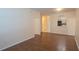Inviting living room featuring wood floors, neutral paint, and doorway to the kitchen at 13584 Turtle Marsh Loop # 12, Orlando, FL 32837