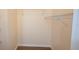 Walk-in closet featuring metal shelving and hardwood floors at 13584 Turtle Marsh Loop # 12, Orlando, FL 32837