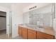Bright bathroom with double sink vanity, large mirror, and separate tub and shower at 148 Miro Dr, Davenport, FL 33837