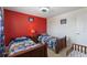 Bedroom with two twin beds, each with colorful vehicle-themed bedding at 148 Miro Dr, Davenport, FL 33837