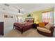 Bright bedroom with large windows, ceiling fan, and neutral walls at 148 Miro Dr, Davenport, FL 33837