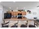 Charming kitchen featuring stainless steel appliances, wooden cabinets and counter seating at 148 Miro Dr, Davenport, FL 33837