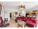 Bright living room featuring comfortable sofa, patio access, and warm ambient lighting at 148 Miro Dr, Davenport, FL 33837