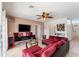 Cozy living room featuring comfortable seating, neutral walls and an airy ceiling fan at 148 Miro Dr, Davenport, FL 33837