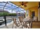 Relaxing screened-in patio featuring a pool and an outdoor dining set, perfect for entertaining at 148 Miro Dr, Davenport, FL 33837