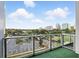 Enjoy the beautiful city skyline view with lush green trees and a park from this private balcony with glass railings at 150 E Robinson St # 407, Orlando, FL 32801