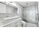 Modern bathroom features double sink vanity, sleek fixtures, and a glass-enclosed shower with marble tiling at 150 E Robinson St # 407, Orlando, FL 32801