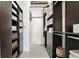 Walk-in closet featuring custom shelving, storage solutions, and organized compartments for clothing and accessories at 150 E Robinson St # 407, Orlando, FL 32801