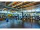 Well-equipped gym with punching bag, weights, machines, mirrors, and natural light at 150 E Robinson St # 407, Orlando, FL 32801