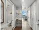 Bright condo hallway featuring hardwood floors and view into kitchen and living area at 150 E Robinson St # 407, Orlando, FL 32801