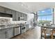 Contemporary kitchen boasts stainless appliances and adjacent spiral staircase to loft at 150 E Robinson St # 407, Orlando, FL 32801