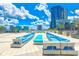 Beautiful rooftop lounge features blue accent seating, manicured plants and great views of the city skyline at 150 E Robinson St # 407, Orlando, FL 32801