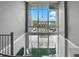 Lofted staircase with large windows offer panoramic city and lake views and abundant natural light at 150 E Robinson St # 407, Orlando, FL 32801