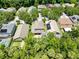 An aerial view of a neighborhood showcasing well-maintained homes and mature trees at 1617 Song Sparrow Ct, Sanford, FL 32773