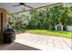 Beautiful backyard featuring a covered patio, lush greenery, and a storage shed at 1617 Song Sparrow Ct, Sanford, FL 32773