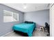 Cozy bedroom featuring a large window with natural light and blue accents at 1617 Song Sparrow Ct, Sanford, FL 32773