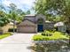 Lovely two-story home with mature landscaping, well manicured lawn, and a two-car garage at 1617 Song Sparrow Ct, Sanford, FL 32773
