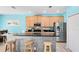 Modern kitchen featuring stainless steel appliances and counter seating at 1617 Song Sparrow Ct, Sanford, FL 32773