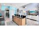 Kitchen with island and open access to living area at 1617 Song Sparrow Ct, Sanford, FL 32773