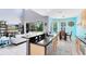 Open-concept kitchen with granite countertops, stainless steel appliances, and a view to the living room at 1617 Song Sparrow Ct, Sanford, FL 32773