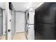 Functional laundry area with stacked washer and dryer, plus extra storage space at 1617 Song Sparrow Ct, Sanford, FL 32773