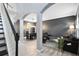 A stunningly modern living room featuring sleek lines, neutral tones and elegant archways at 1617 Song Sparrow Ct, Sanford, FL 32773
