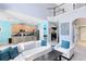 Bright living space with a view of the kitchen and upstairs balcony at 1617 Song Sparrow Ct, Sanford, FL 32773