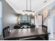 Open concept living area with table and view of staircase at 1617 Song Sparrow Ct, Sanford, FL 32773