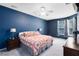 Spacious main bedroom featuring a ceiling fan, two windows, and neutral-toned carpeting at 1617 Song Sparrow Ct, Sanford, FL 32773