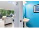 Convenient powder room with a pedestal sink, located near the main living area at 1617 Song Sparrow Ct, Sanford, FL 32773