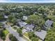 Aerial view of the home nestled among mature trees in a well-established neighborhood setting at 1780 Mizell Ave., Winter Park, FL 32789