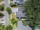Aerial shot of the property showing the house, manicured lawn, and surrounding neighborhood with mature trees at 1780 Mizell Ave., Winter Park, FL 32789