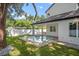 Backyard pool with patio area amidst a green lawn at 1780 Mizell Ave., Winter Park, FL 32789