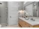 Well-lit bathroom featuring a sleek vanity, walk-in shower, and tile flooring at 1780 Mizell Ave., Winter Park, FL 32789