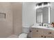 Stylish bathroom featuring sleek vanity, modern mirror, and walk-in shower at 1780 Mizell Ave., Winter Park, FL 32789